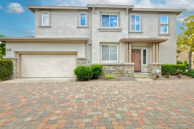 a front view of a house with yard
