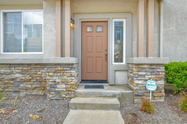 a front view of a house with a yard