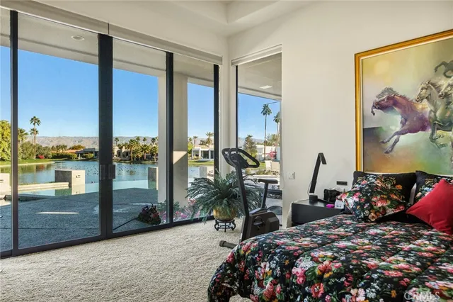 a bathroom with a granite countertop sink and a toilet