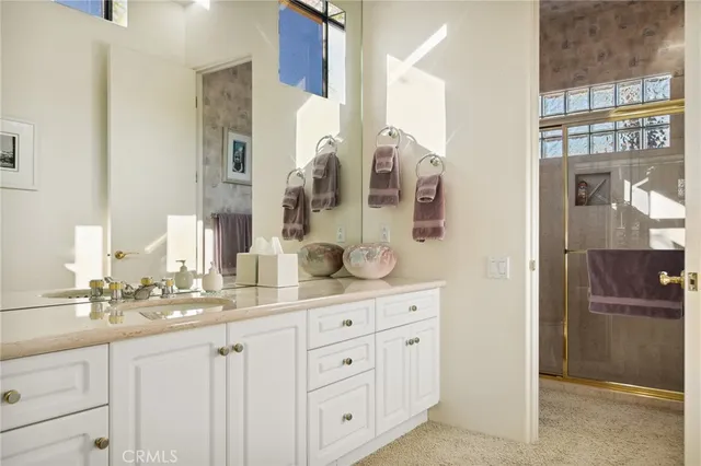 a kitchen with stainless steel appliances white cabinets and a stove