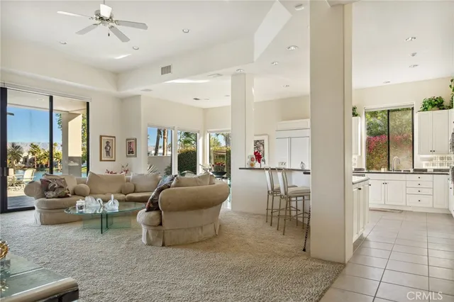 a large bathroom with a granite countertop double vanity and a mirror