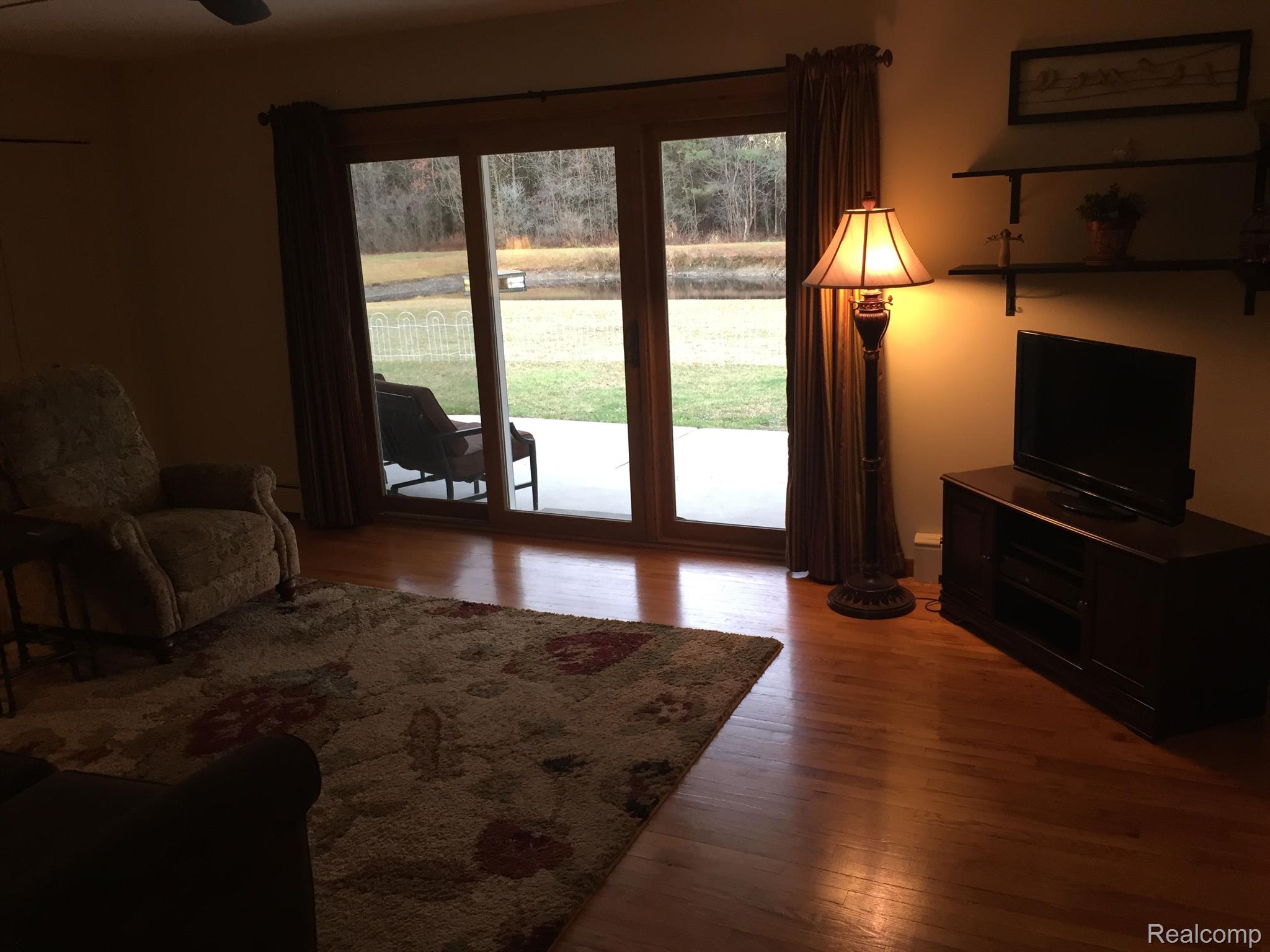 5657 Cribbins Road Avoca, MI 48006 - Photo 9 of 66 Living room with doorwall to covered back porch