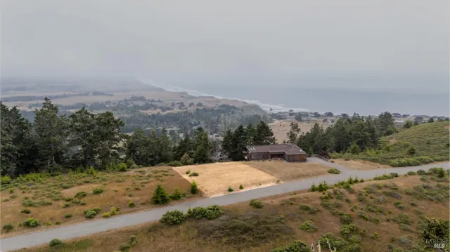 a view of a road with a yard