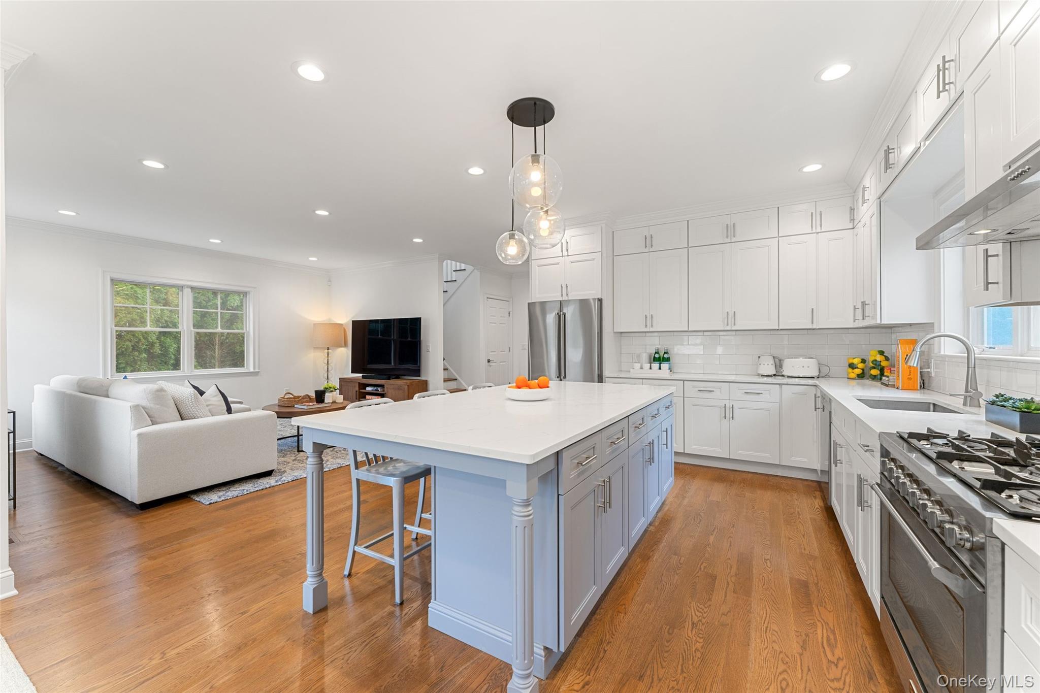 109 Lee Road Scarsdale, NY 10583 - Photo 14 of 33 Huge kitchen island overlooking the family room