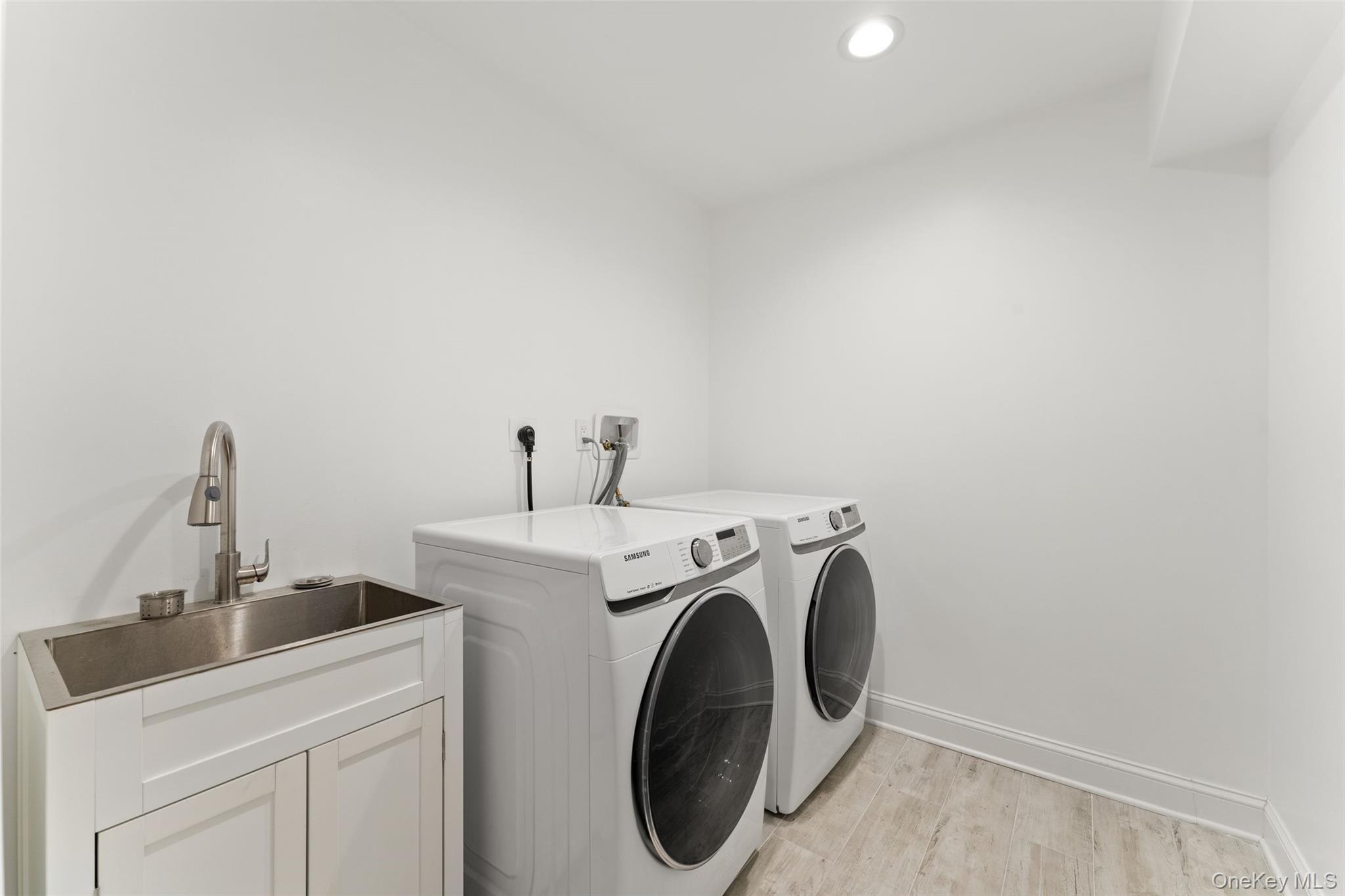 109 Lee Road Scarsdale, NY 10583 - Photo 27 of 33 Laundry room with washer and dryer