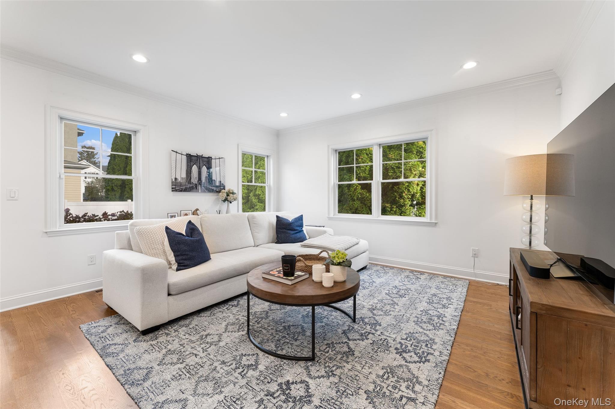 109 Lee Road Scarsdale, NY 10583 - Photo 7 of 33 Family room with wrap around windows