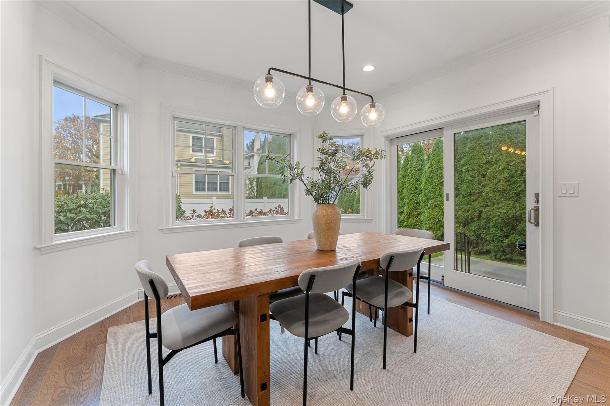 109 Lee Road Scarsdale, NY 10583 - Photo 9 of 33 Dining area with sliders to patio