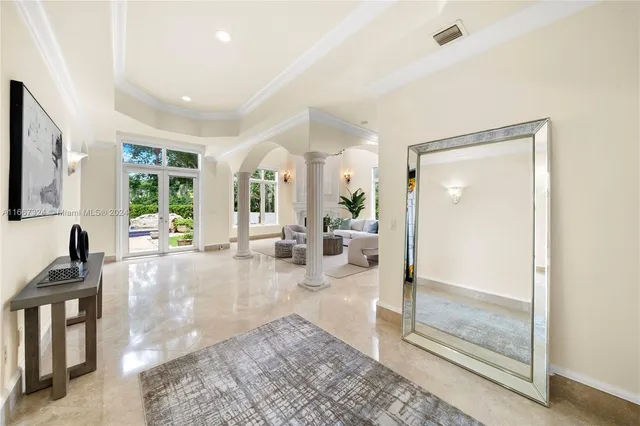a living room with furniture potted plant and a fireplace
