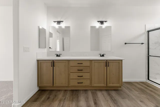 a bathroom with a mirror and a sink