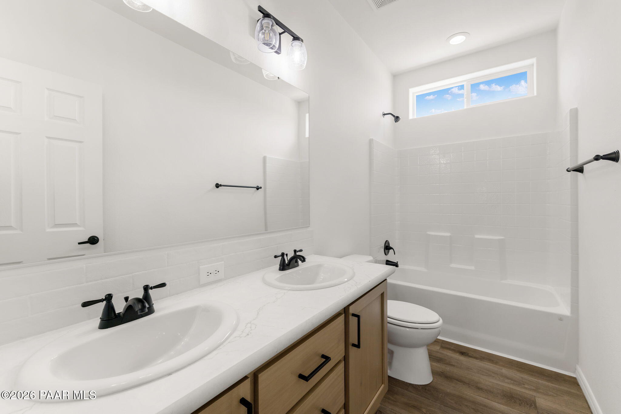 9905 East Ringold Road Dewey-Humboldt, AZ 86327 - Photo 18 of 20 a bathroom with a sink a toilet and shower