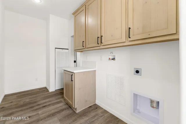 a view of cabinets and wooden floor