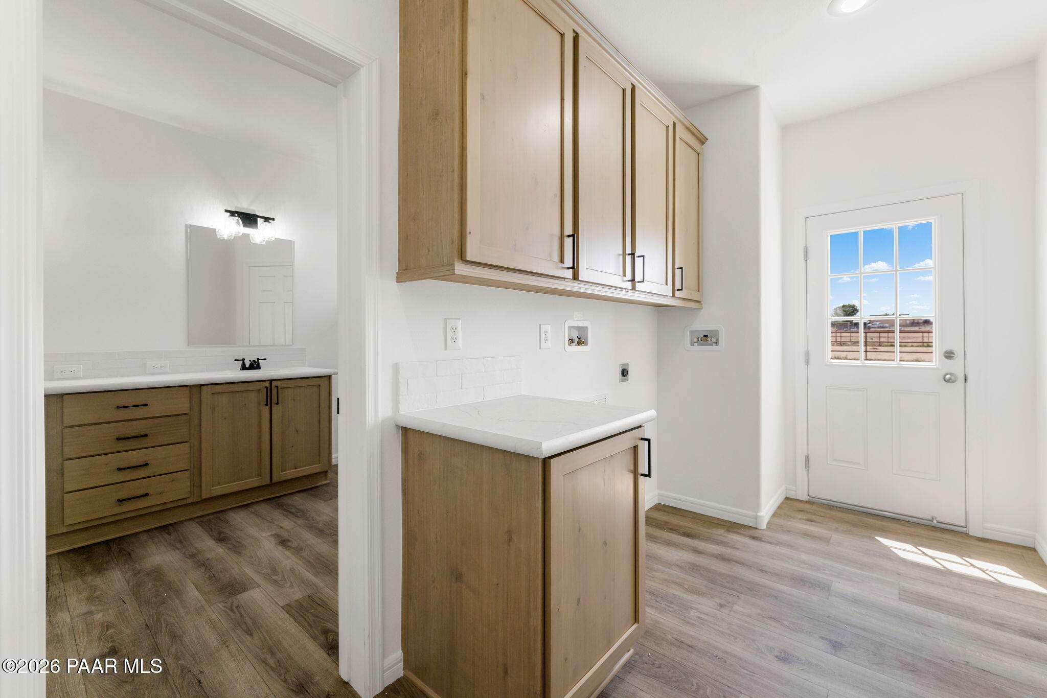 9905 East Ringold Road Dewey-Humboldt, AZ 86327 - Photo 20 of 20 a kitchen with cabinets appliances and a wooden floor