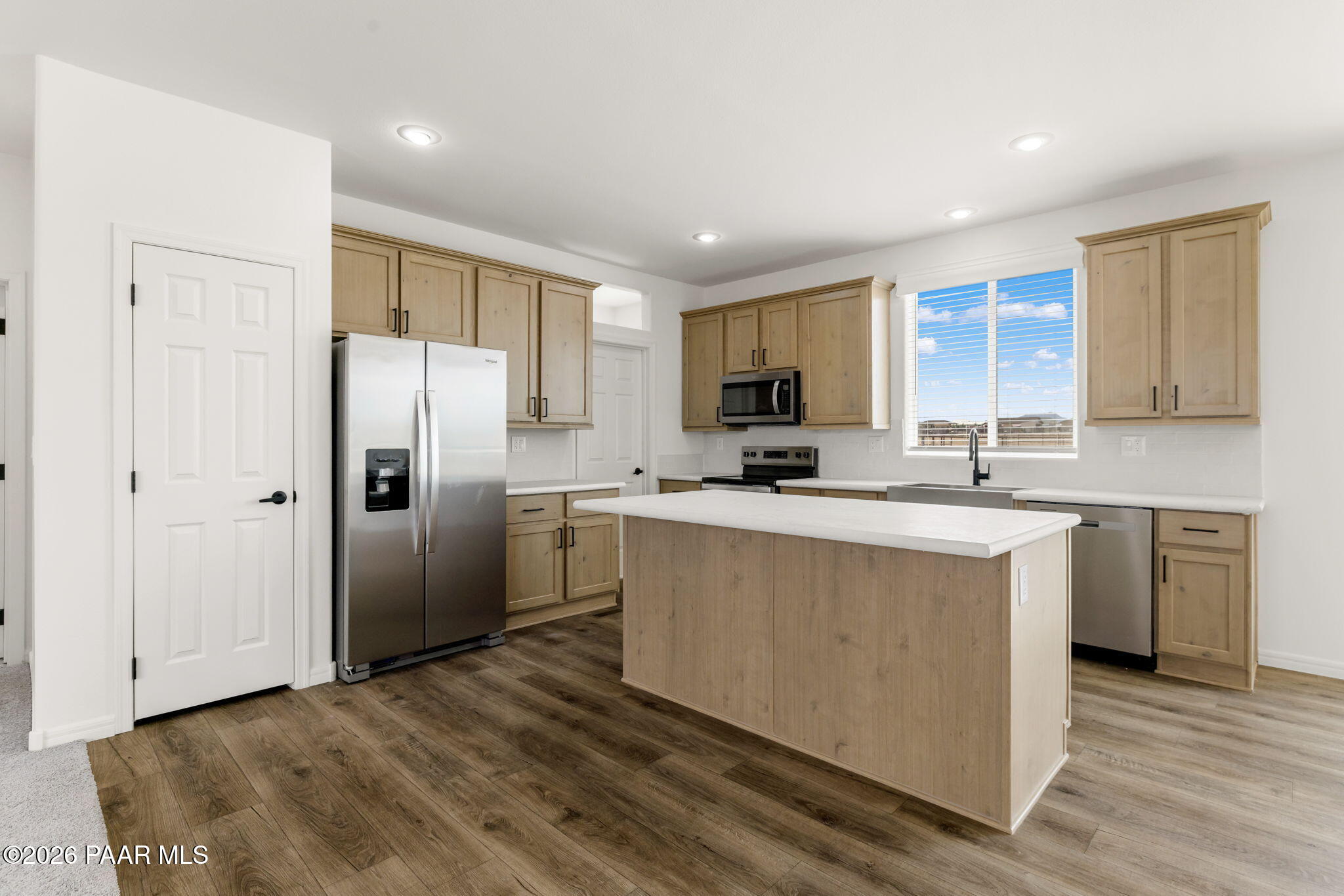 9905 East Ringold Road Dewey-Humboldt, AZ 86327 - Photo 5 of 20 a kitchen with stainless steel appliances a refrigerator sink and cabinets