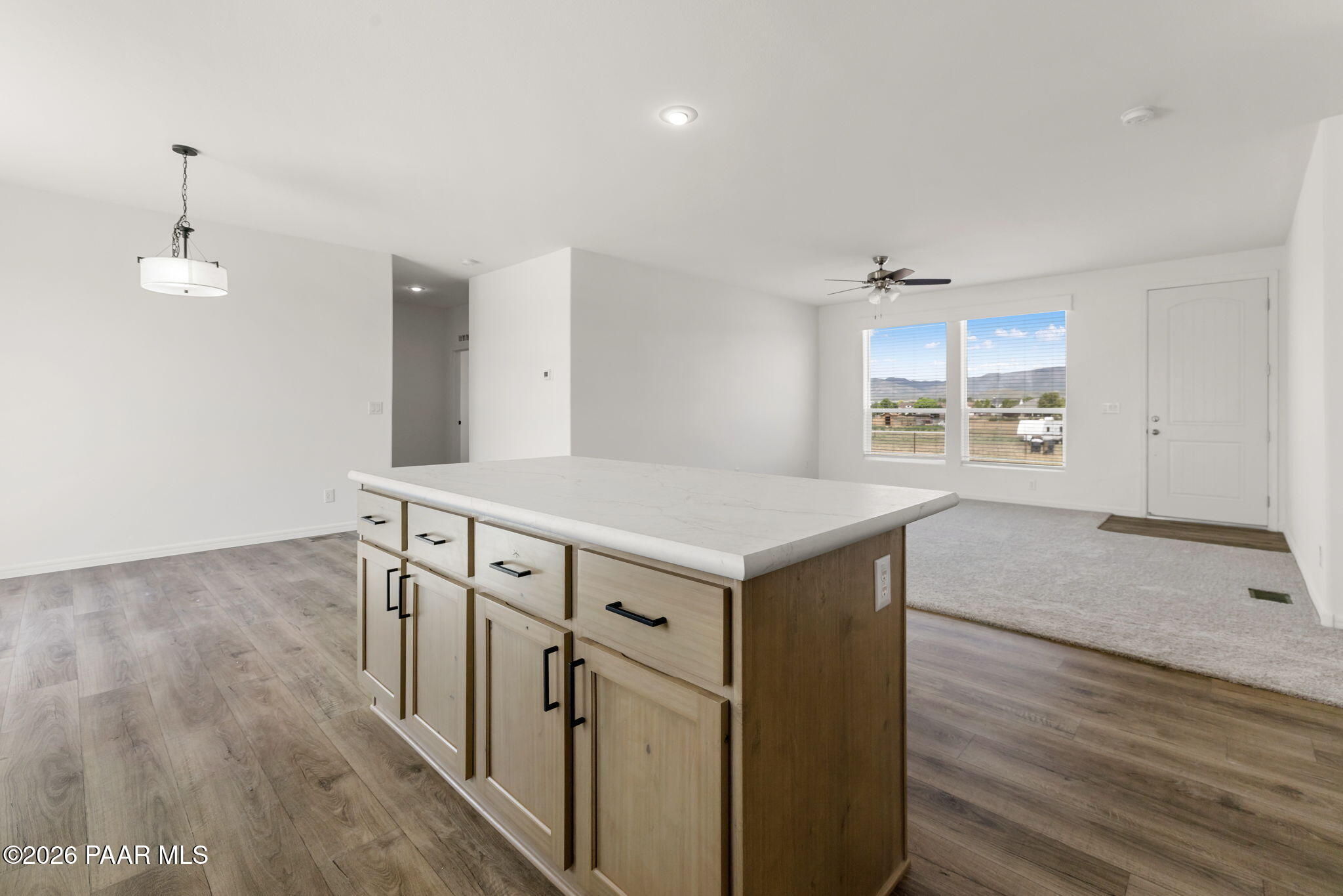 9905 East Ringold Road Dewey-Humboldt, AZ 86327 - Photo 8 of 20 a kitchen with a wooden floor and window