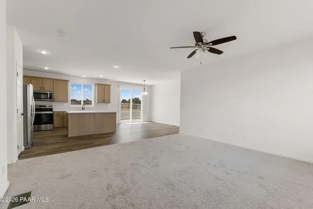 a view of a kitchen with a sink and cabinets