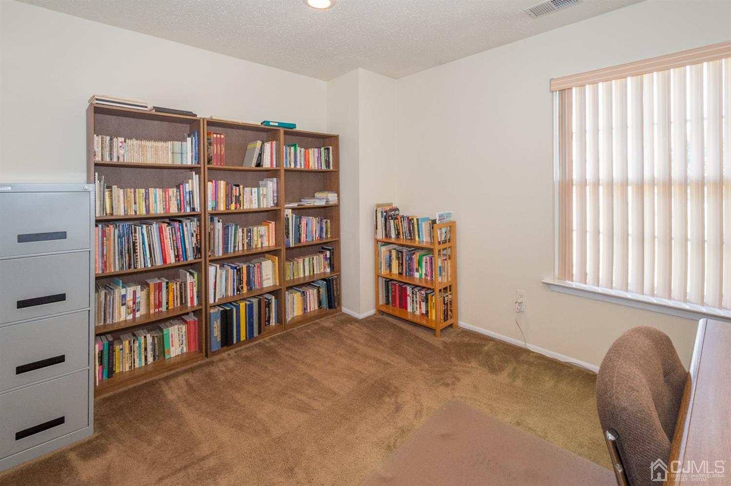 302 Pegasus Road Piscataway, NJ 08854 - Photo 12 of 27 a view of a room with windows and book shelf