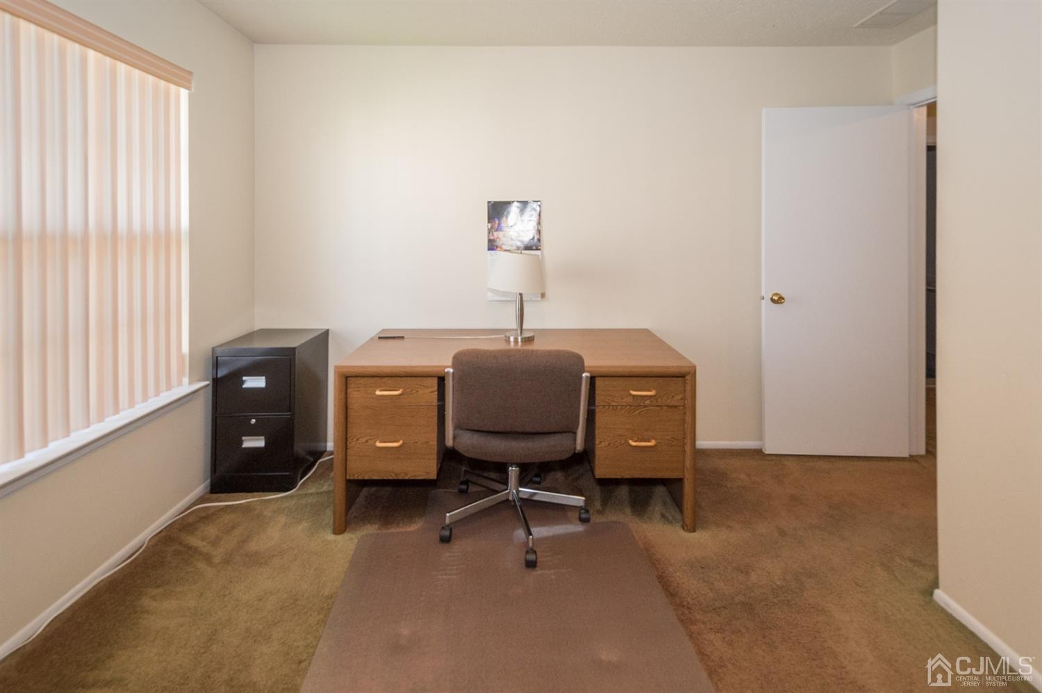 302 Pegasus Road Piscataway, NJ 08854 - Photo 13 of 27 a view of workspace with furniture and a window