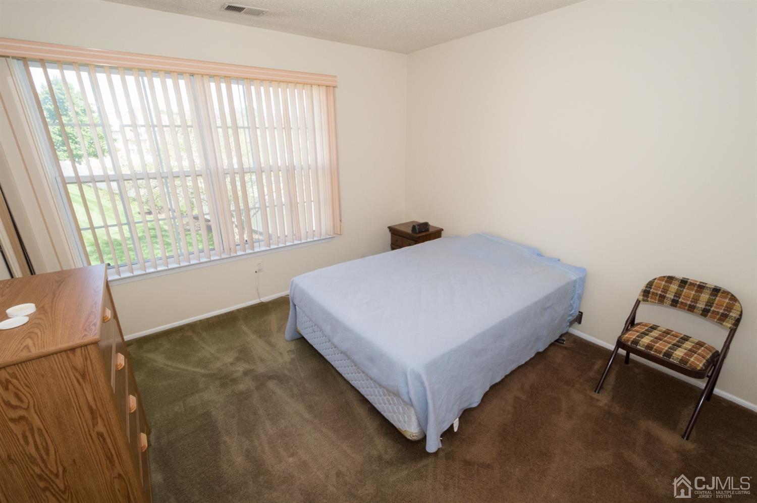 302 Pegasus Road Piscataway, NJ 08854 - Photo 15 of 27 a bedroom with a bed and a window