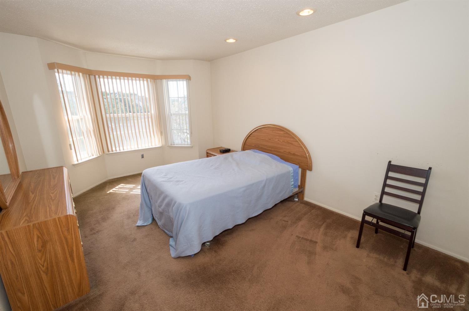 302 Pegasus Road Piscataway, NJ 08854 - Photo 16 of 27 a bedroom with a bed and a window