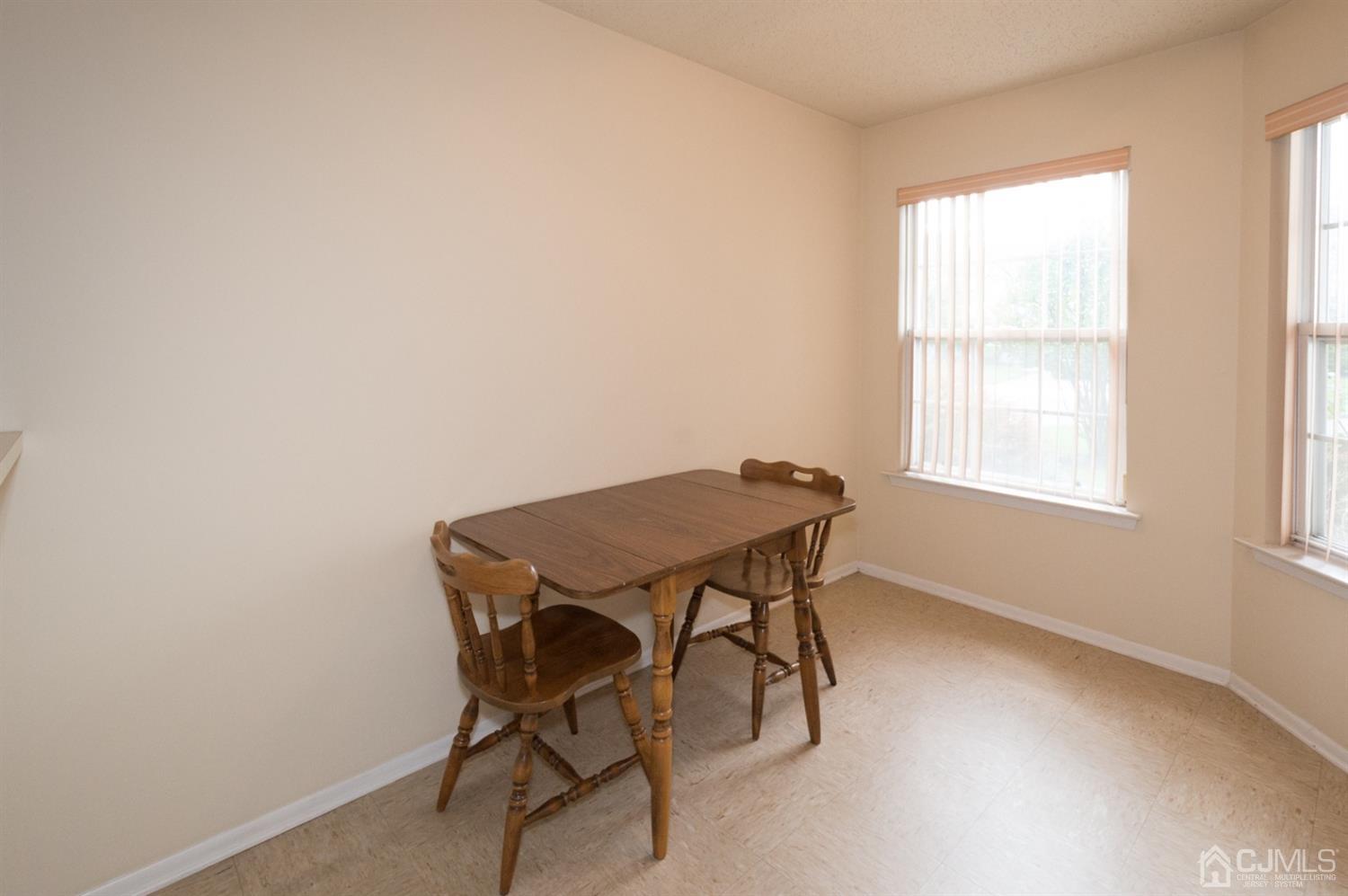 302 Pegasus Road Piscataway, NJ 08854 - Photo 3 of 27 a view of a workspace with furniture and a window