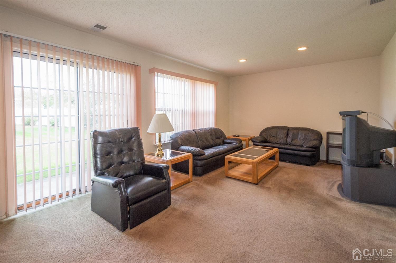 302 Pegasus Road Piscataway, NJ 08854 - Photo 6 of 27 a living room with furniture and a window