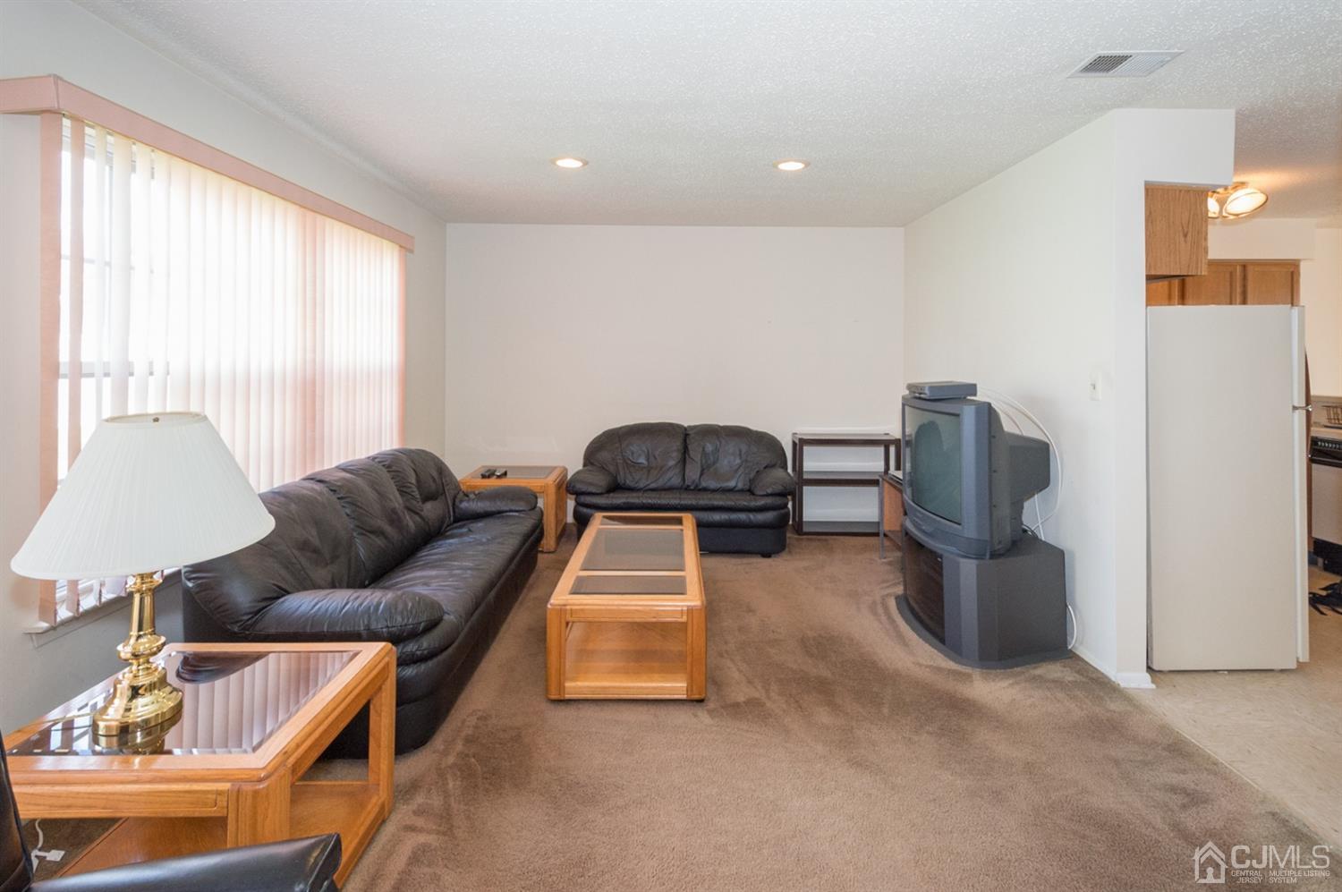 302 Pegasus Road Piscataway, NJ 08854 - Photo 7 of 27 a living room with furniture and a window