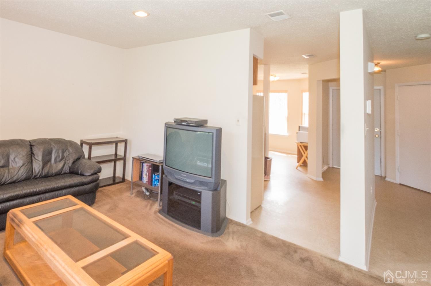 302 Pegasus Road Piscataway, NJ 08854 - Photo 8 of 27 a living room with furniture and a flat screen tv