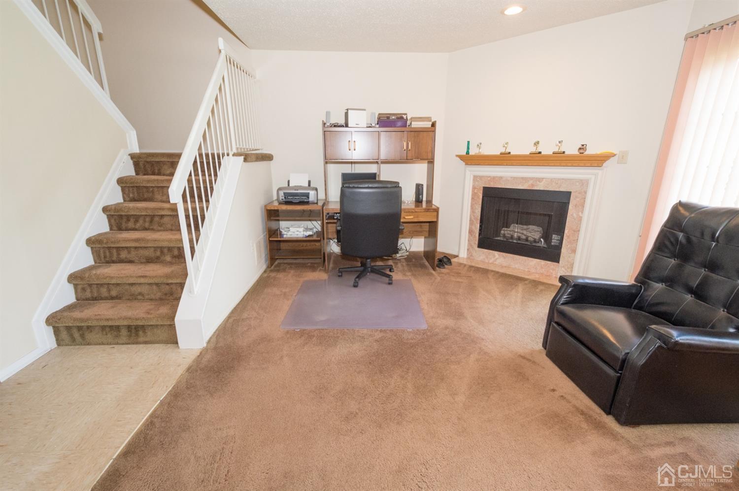 302 Pegasus Road Piscataway, NJ 08854 - Photo 9 of 27 a living room with furniture and a fireplace