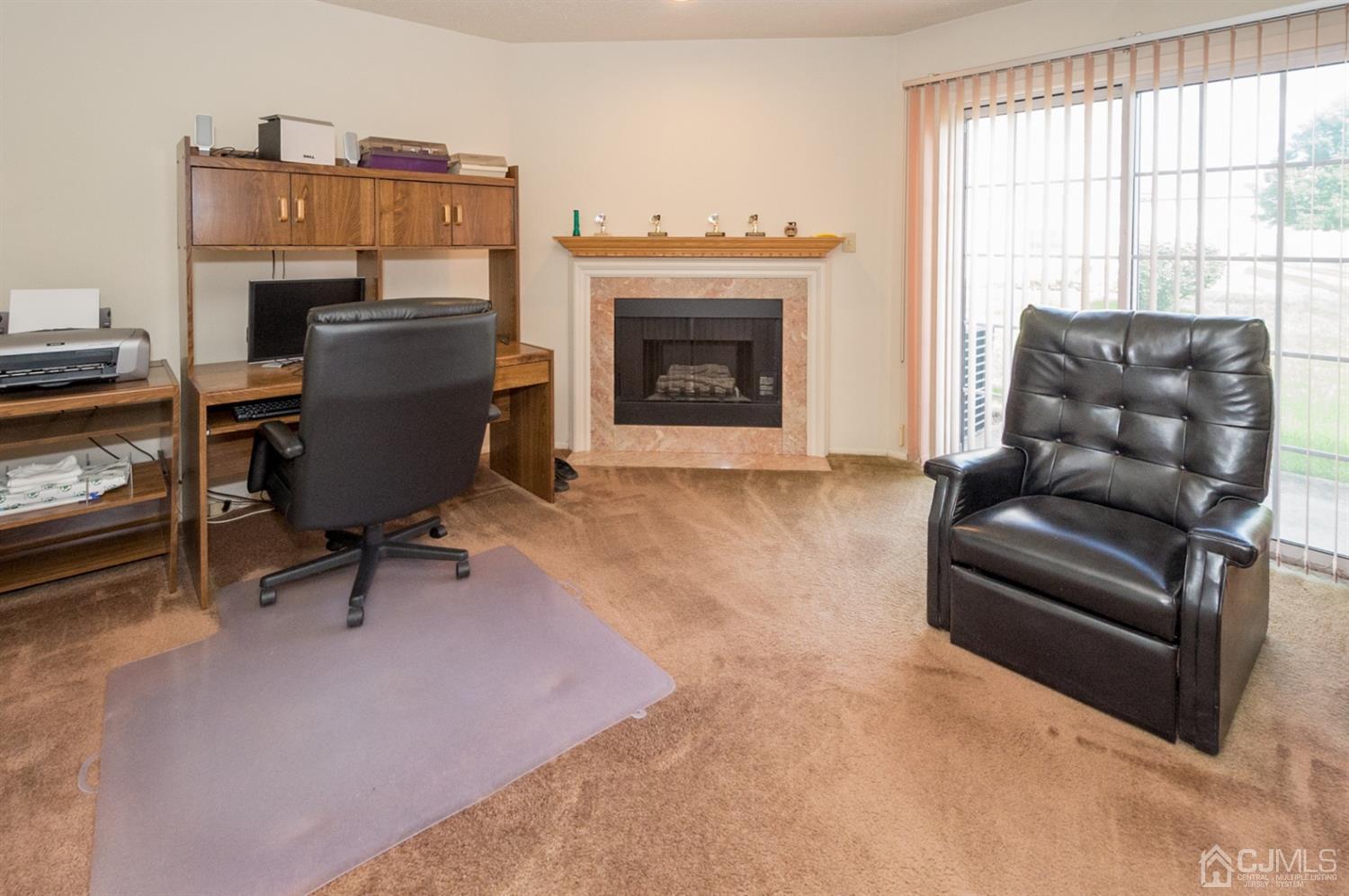 302 Pegasus Road Piscataway, NJ 08854 - Photo 10 of 27 a living room with furniture a piano and a fireplace