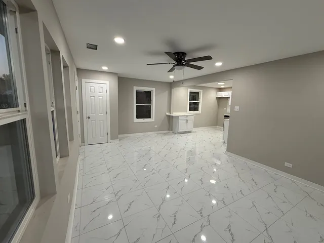 a view of a livingroom with a kitchen