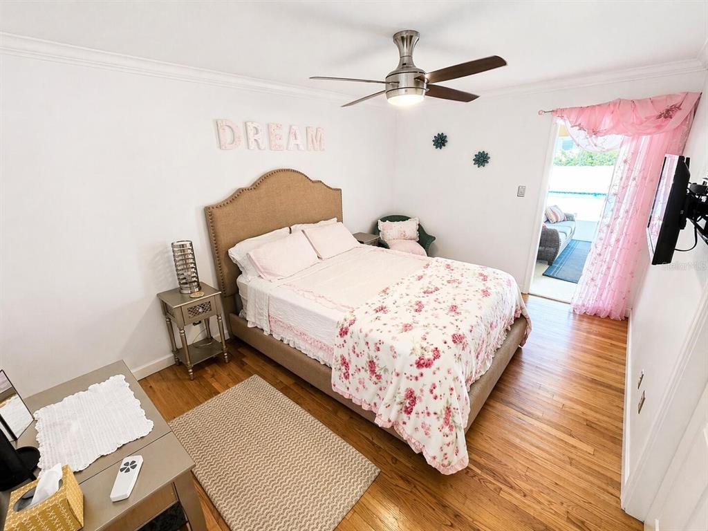 2313 Southeast 7th Street Ocala, FL 34471 - Photo 25 of 54 a large bed sitting in a bedroom next to a window