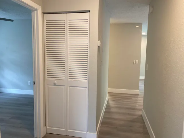 a view of a bathroom from the hallway