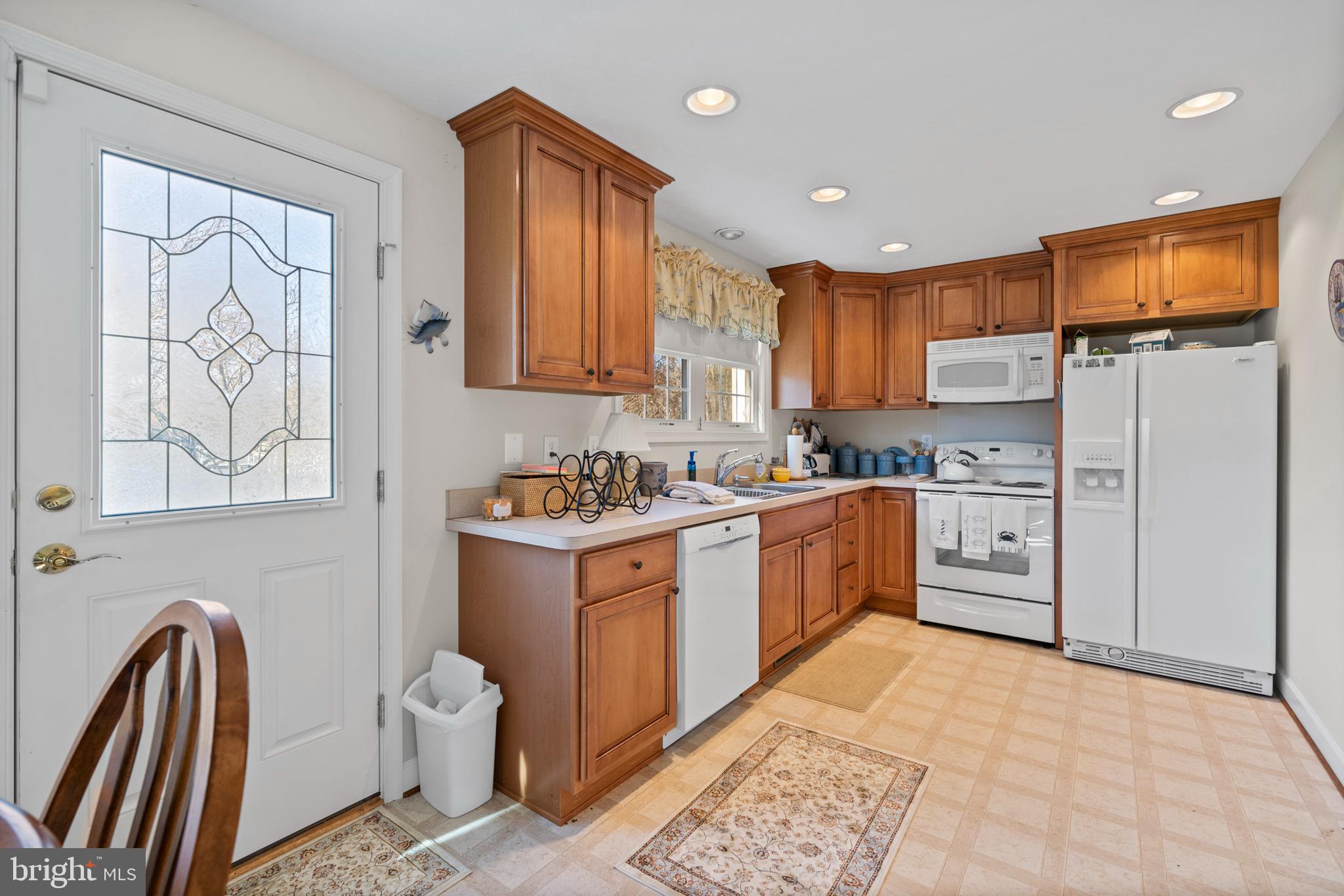24991 Briscoe Road Hollywood, MD 20636 - Photo 126 of 130 a kitchen with stainless steel appliances granite countertop a refrigerator sink and cabinets