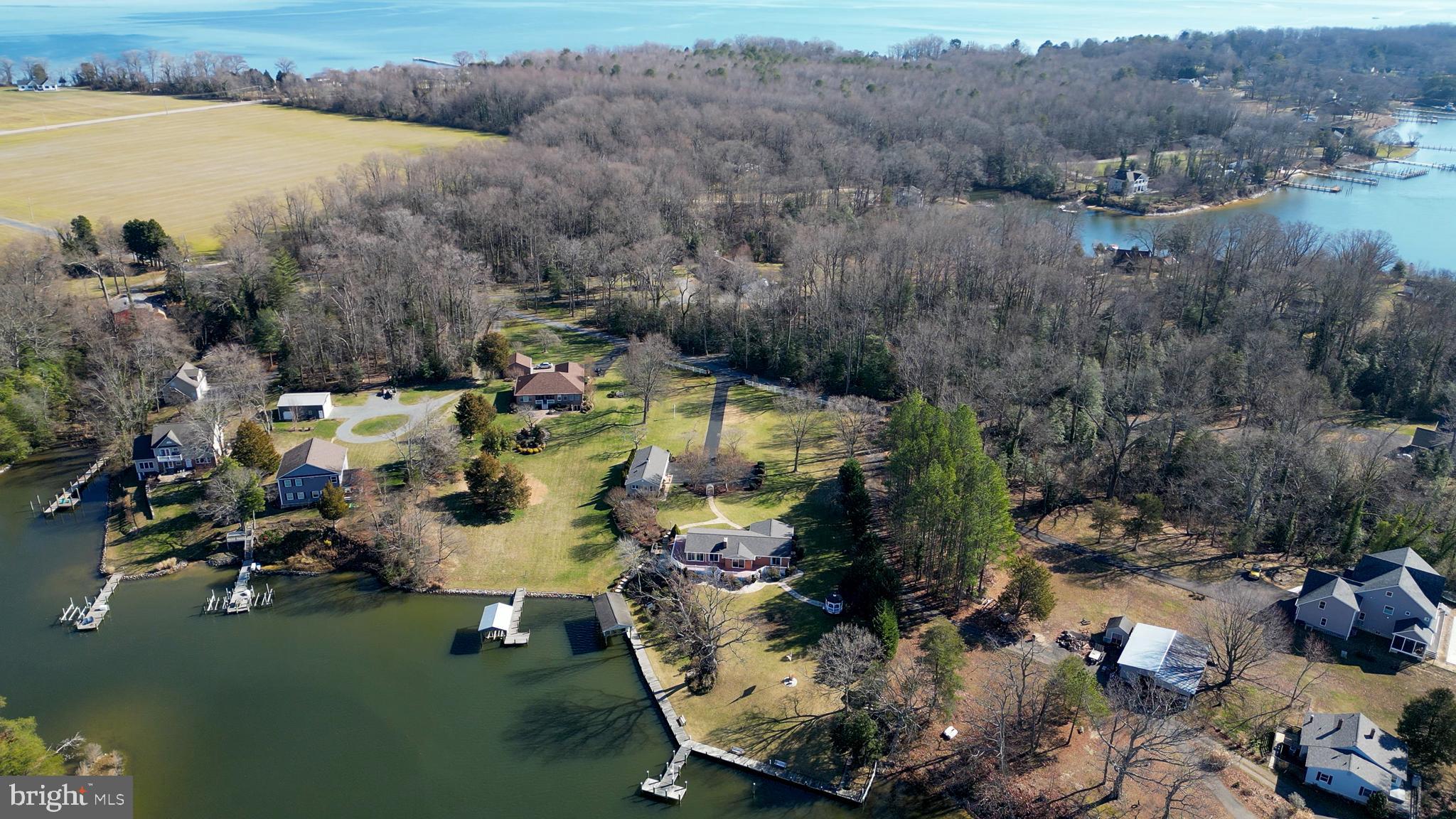 24991 Briscoe Road Hollywood, MD 20636 - Photo 15 of 130 an aerial view of a house with outdoor space and a lake view