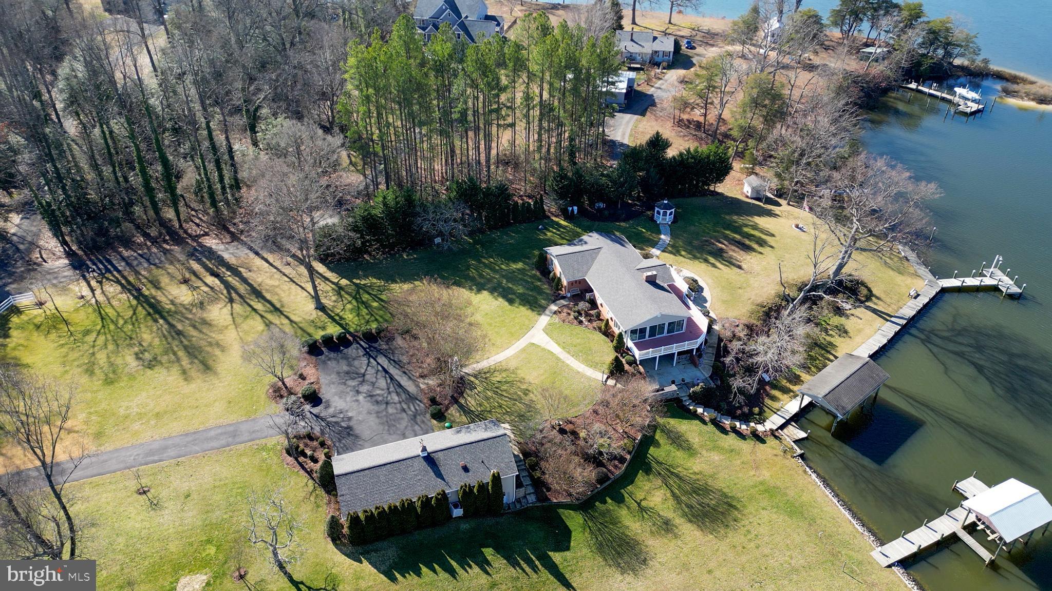 24991 Briscoe Road Hollywood, MD 20636 - Photo 3 of 130 an aerial view of house with yard swimming pool and outdoor seating