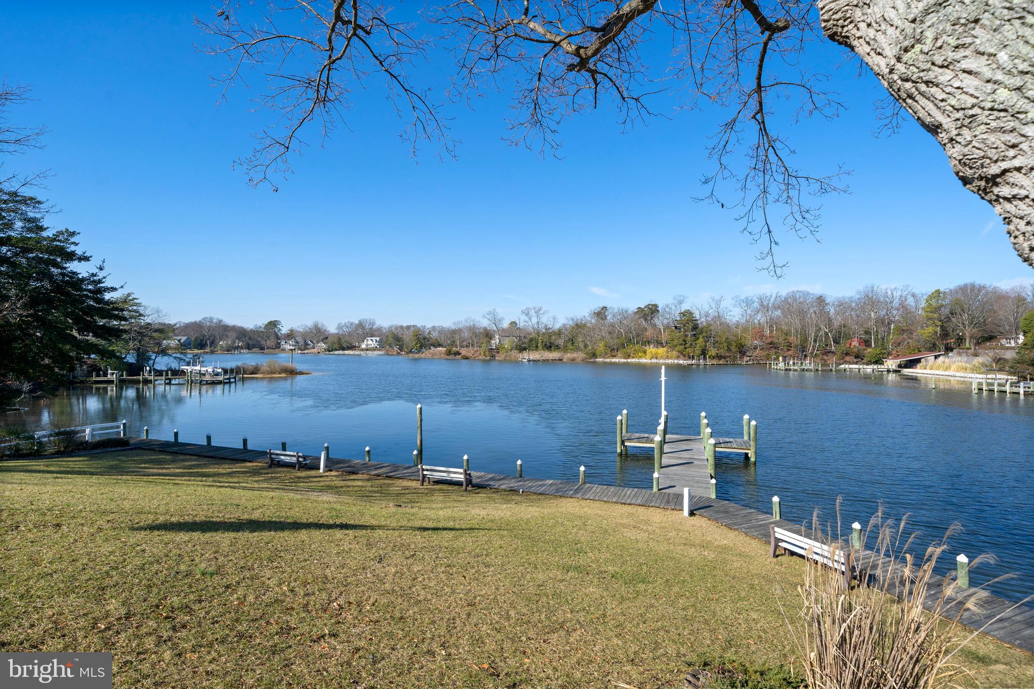 24991 Briscoe Road Hollywood, MD 20636 - Photo 42 of 130 a view of a lake with a building in the background