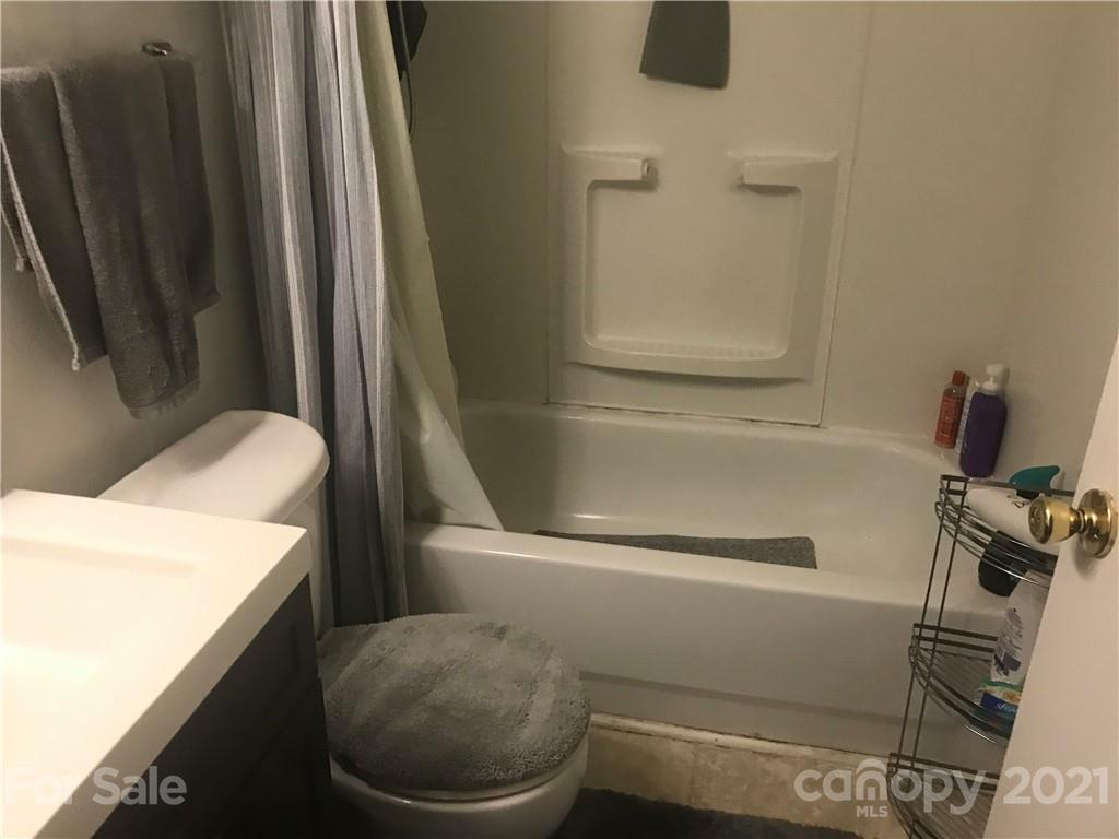 1219 Skyview Road Charlotte, NC 28208 - Photo 3 of 3 a bathroom with a sink and a toilet