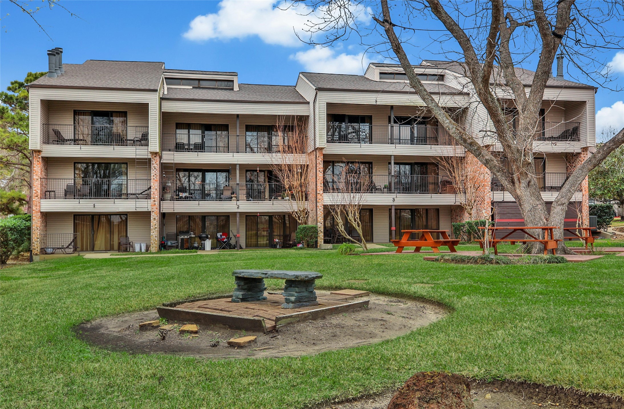 1000 April Sound Boulevard Conroe, TX 77356 - Photo 39 of 46 a view of a building with a yard