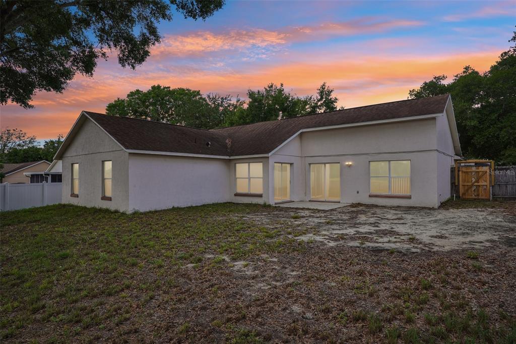 2596 Alclobe Circle Ocoee, FL 34761 - Photo 56 of 70 a front view of a house with a garden