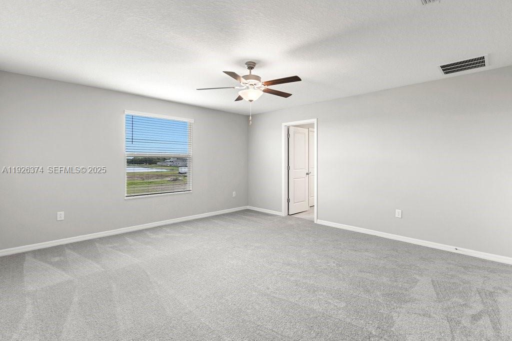 5351 Night Tide Lane Wimauma, FL 33598 - Photo 12 of 22 a view of an empty room with a window