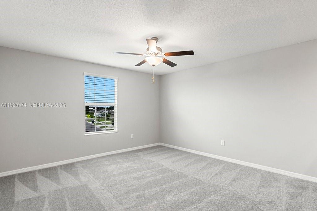 5351 Night Tide Lane Wimauma, FL 33598 - Photo 13 of 22 a view of an empty room with a window