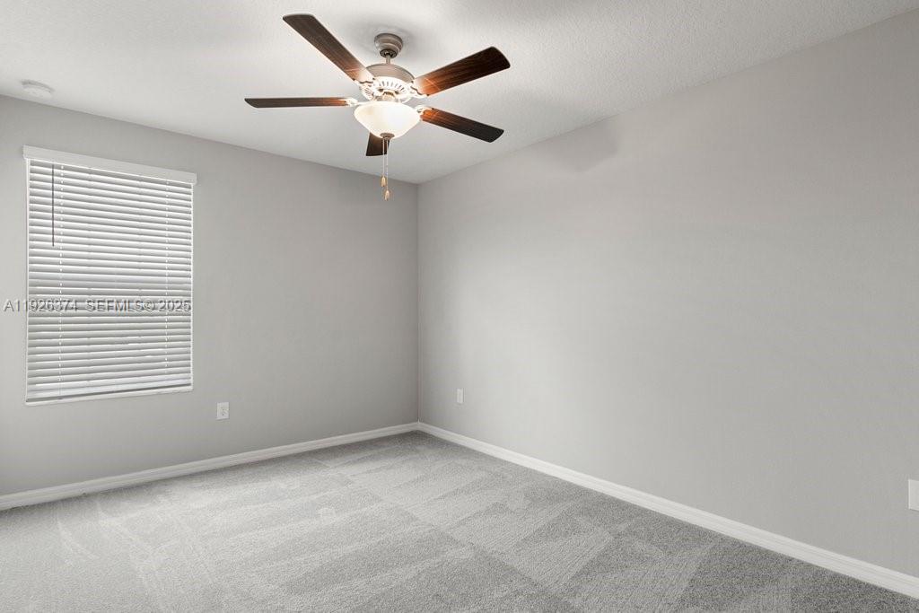 5351 Night Tide Lane Wimauma, FL 33598 - Photo 15 of 22 an empty room with a window