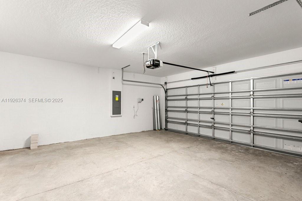 5351 Night Tide Lane Wimauma, FL 33598 - Photo 18 of 22 a view of a garage