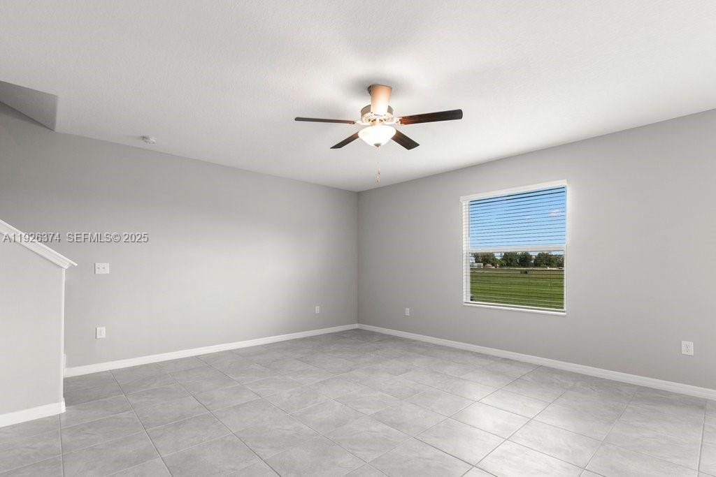 5351 Night Tide Lane Wimauma, FL 33598 - Photo 4 of 22 a view of an empty room with a window