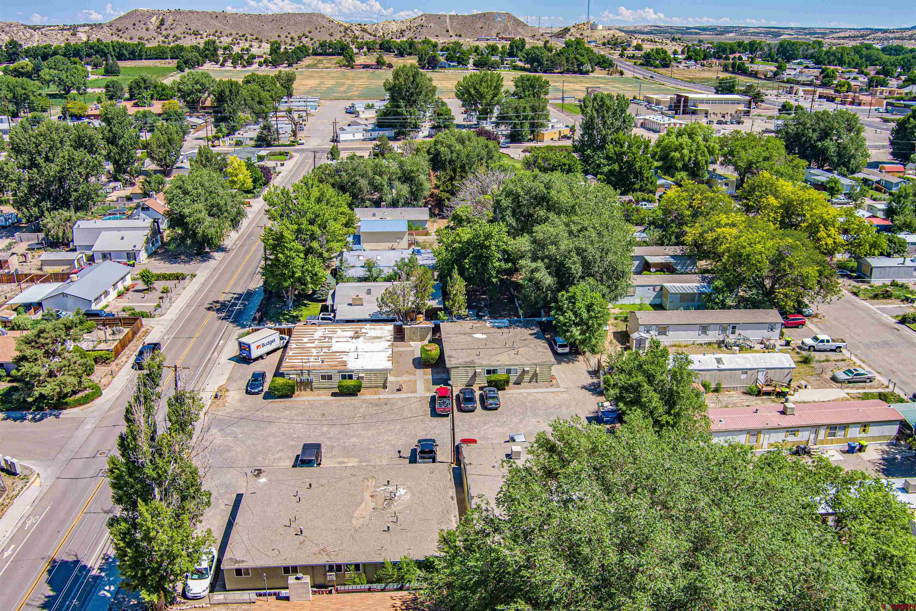 500 North 3rd Street Bloomfield, NM 87413 - Photo 17 of 33 an aerial view of residential houses with outdoor space and river view