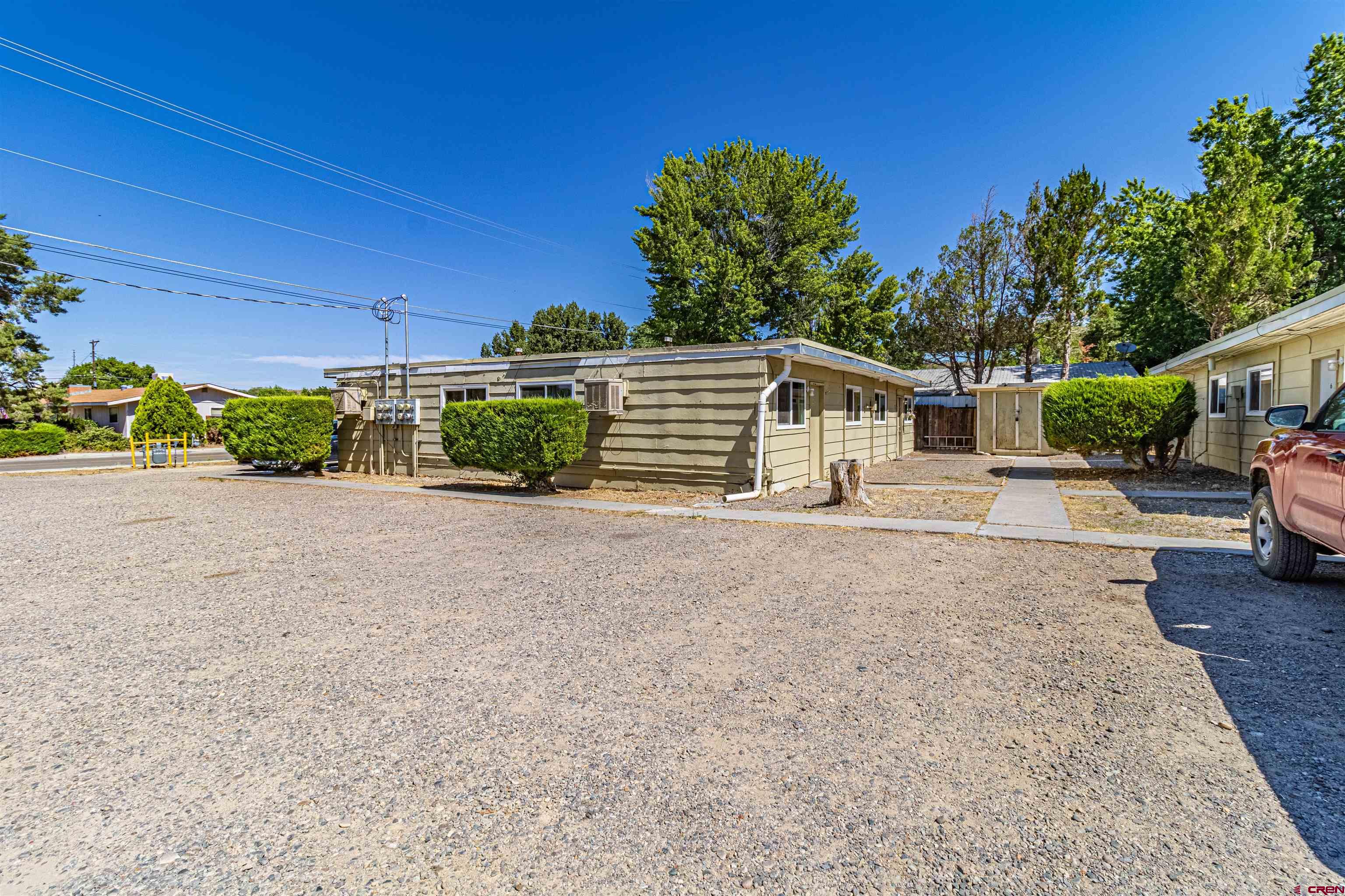 500 North 3rd Street Bloomfield, NM 87413 - Photo 30 of 33 a view of a house with backyard and a parking space