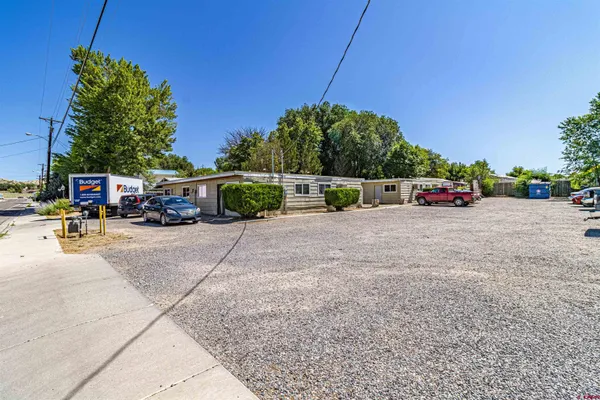 a view of a cars parked in front of a house