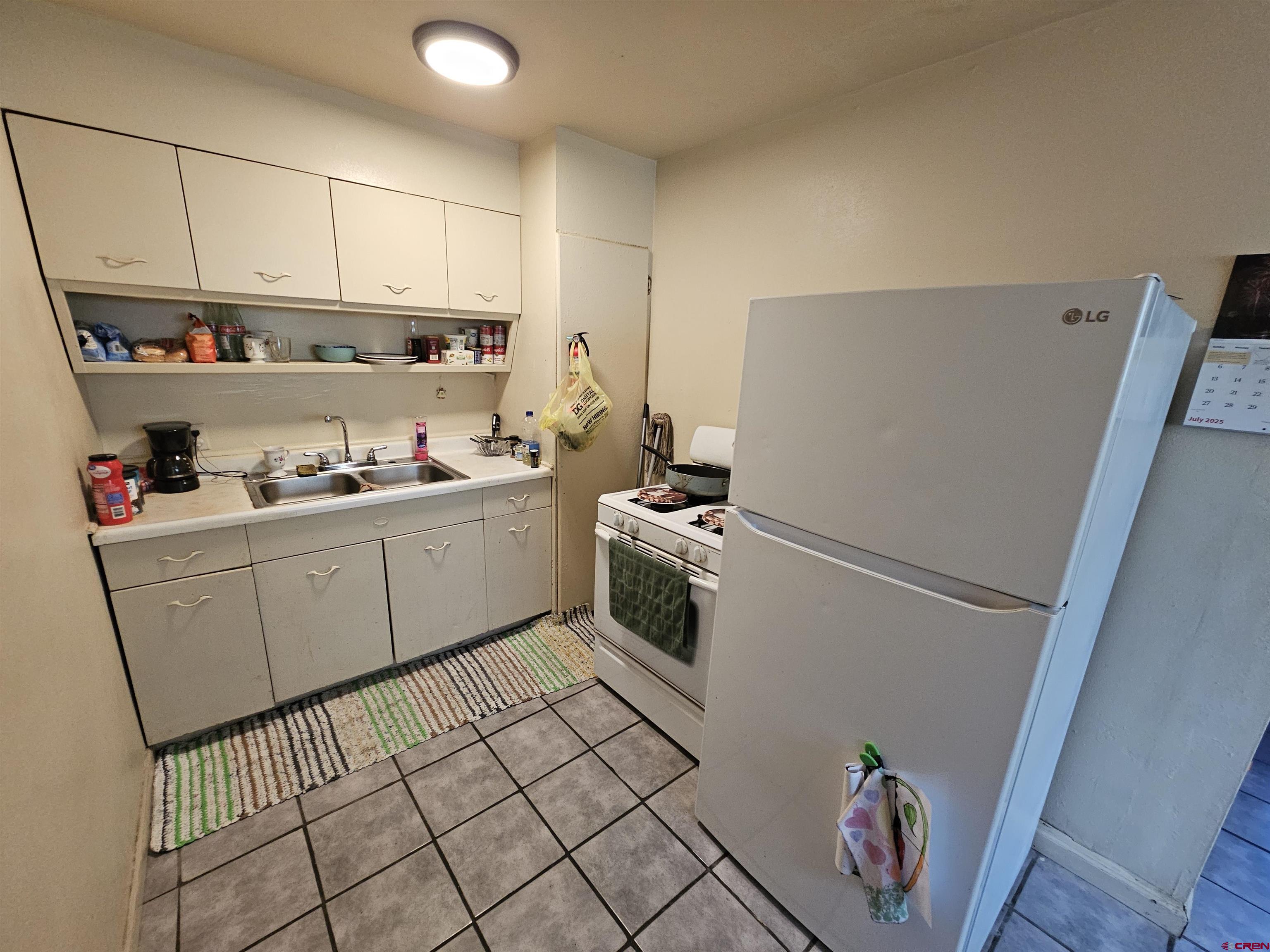 500 North 3rd Street Bloomfield, NM 87413 - Photo 6 of 33 a kitchen with sink cabinets and appliances