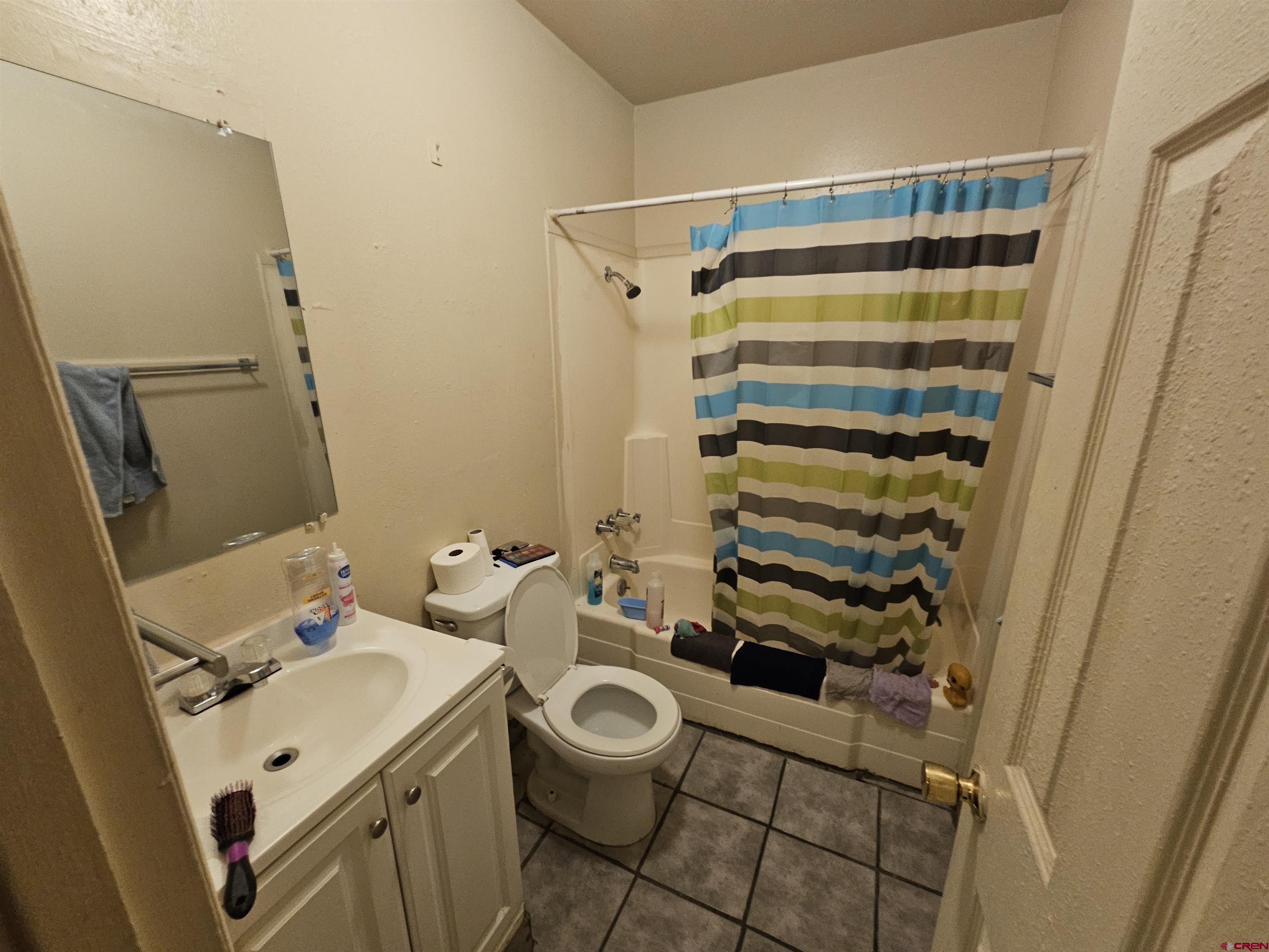 500 North 3rd Street Bloomfield, NM 87413 - Photo 7 of 33 a bathroom with a sink toilet and shower