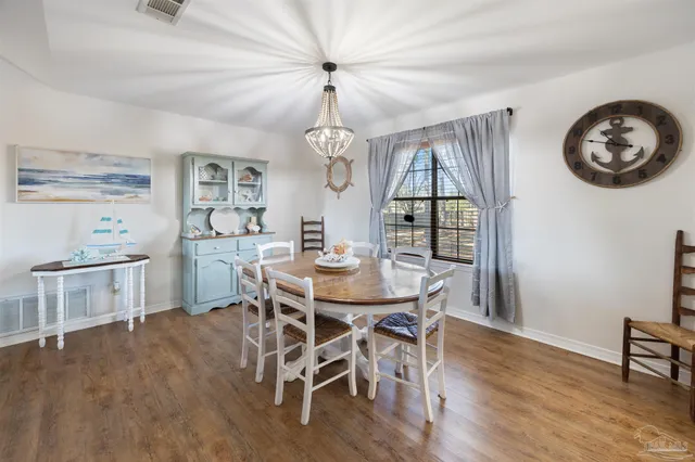 a large kitchen with stainless steel appliances granite countertop a lot of counter space